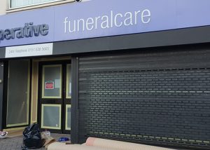 shop front respray COOP Funeralcare Wallasey